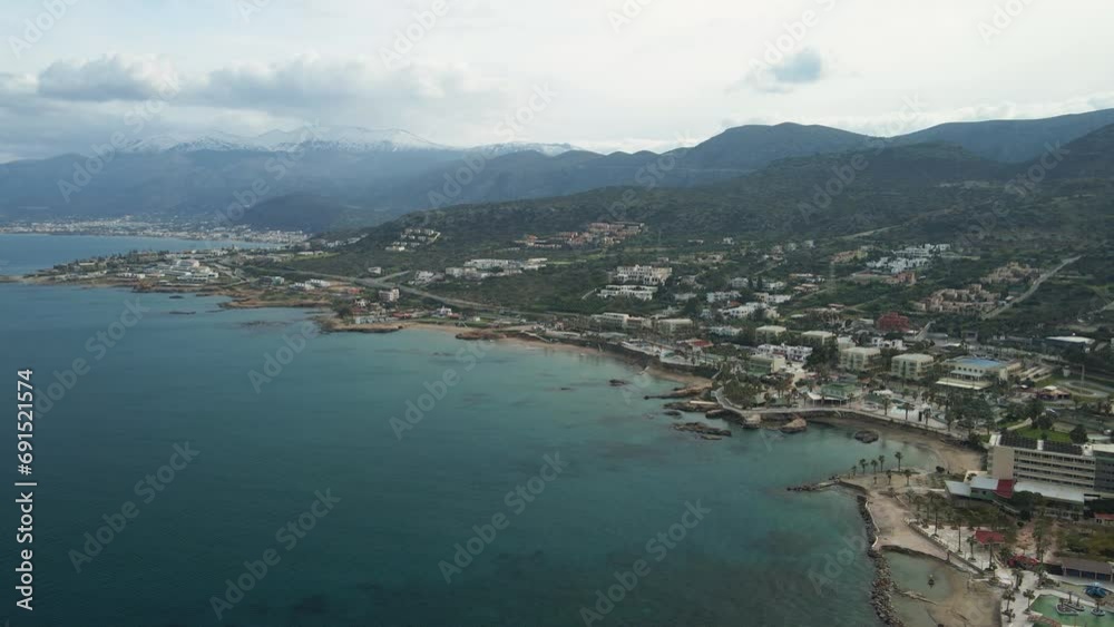 Aerial view by drone of idyllic seascape with snowy mountains. Aerial view by drone of idyllic seascape with snowy mountains.