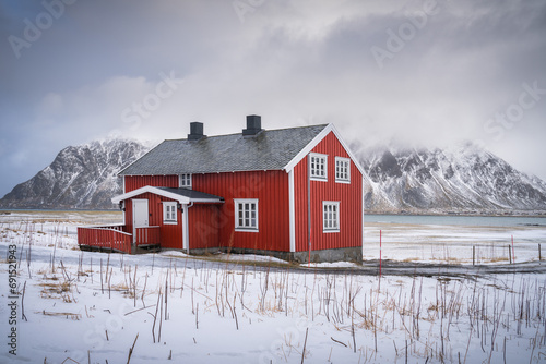 Typical Lofoten red house in the snow