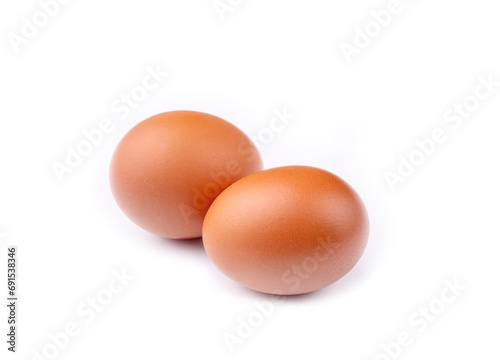 Raw eggs on the white backg...