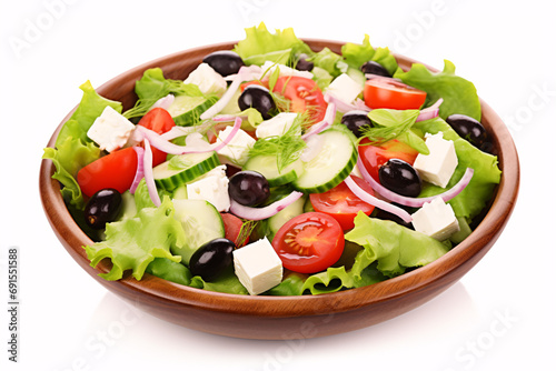 A Greek salad of cheese and veggies isolated on white.