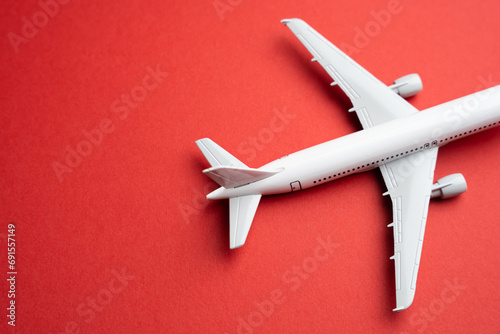 Airlines plane on a red background. Booking flight tickets. Planning your trips. Additional service at airports. Arrival and departure. Business and tourism. Airline.