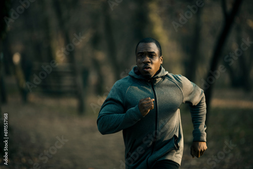 Young man running outdoor in forest
