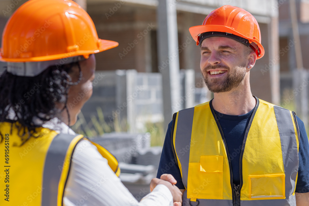 Happy construction engineer handshaking. Builder man enjoy working job deal contact with partner team smile together. Happy construction engineer handshaking. Builder man enjoy working job deal contact with partner team smile together.
