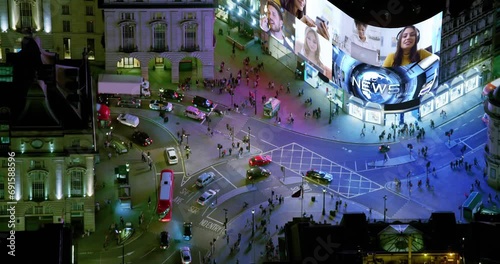Aerial View of Famous Video Display in London Piccadilly Circus, United Kingdom. All videos Included in my Portfolio.  Regent Street and Shaftesbury Avenue Full of People and Traffic. 
 photo