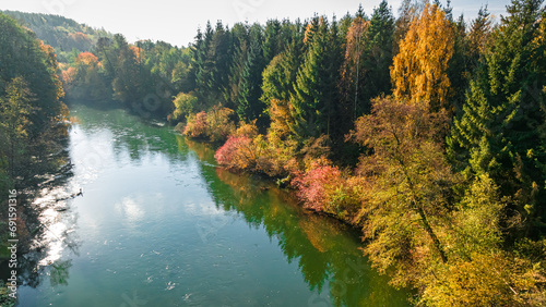 Fototapeta Naklejka Na Ścianę i Meble -  Autumn colorful forest and river Brda at sunrise in Poland.