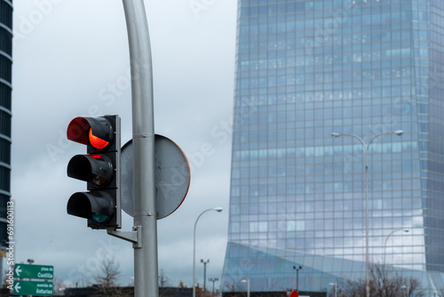 Traffic light in a modern financial area in the city of Madrid in Spain photo