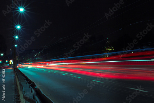 Blurry lights from the headlights of cars on the road