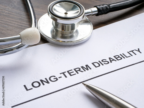 Foto Documents about long term disability and stethoscope.