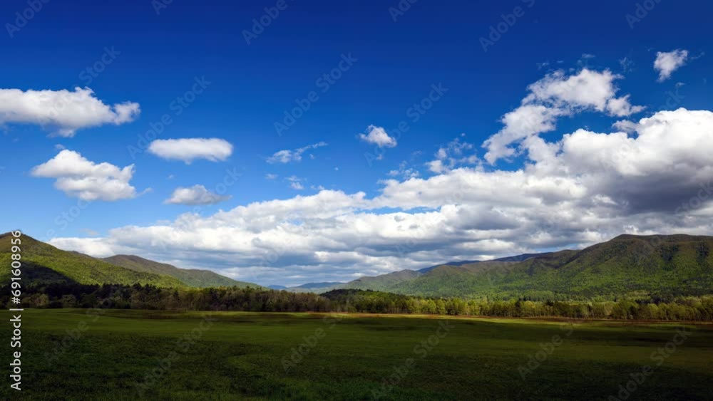 Witness the breathtaking beauty of clouds gracefully gliding over the magnificent Great Smoky Mountains in Cades Cove. Witness the breathtaking beauty of clouds gracefully gliding over the magnificent Great Smoky Mountains in Cades Cove.