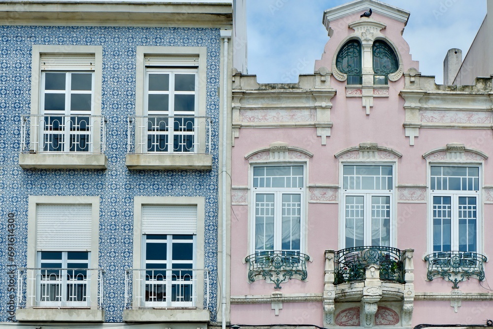 Classical vintage buildings of different colour decorated with traditional ceramical tiles downtown Aveiro, Portugal