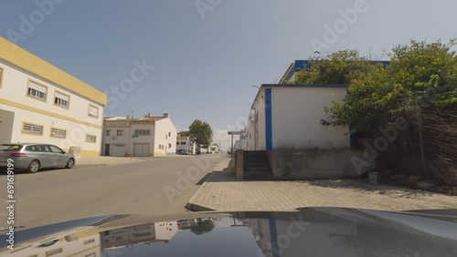 First person view, FPV, from dashcam of car driving on an industrial site on the outskirts of Sines, Portugal. Road trip video in POV photo