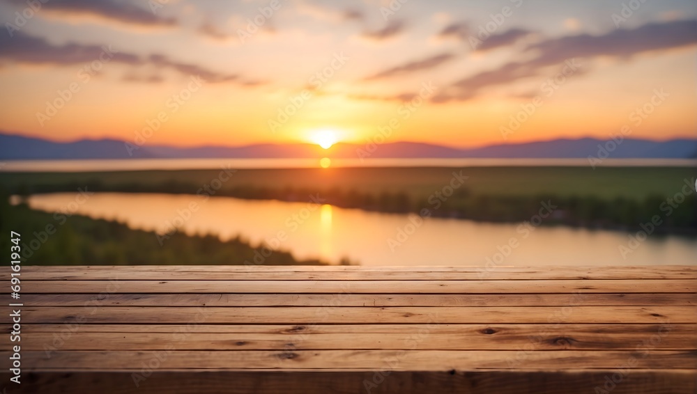 empty wooden table and blurred romantic sunset