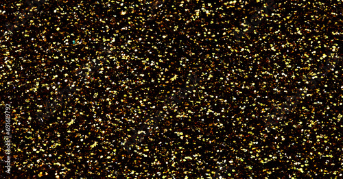 Gold glitter texture sparkling shiny background for Christmas card. Twinkly golden glitter lights grunge background.