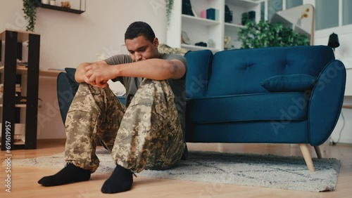 Depressed African American military suffering posttraumatic syndrome, crisis photo