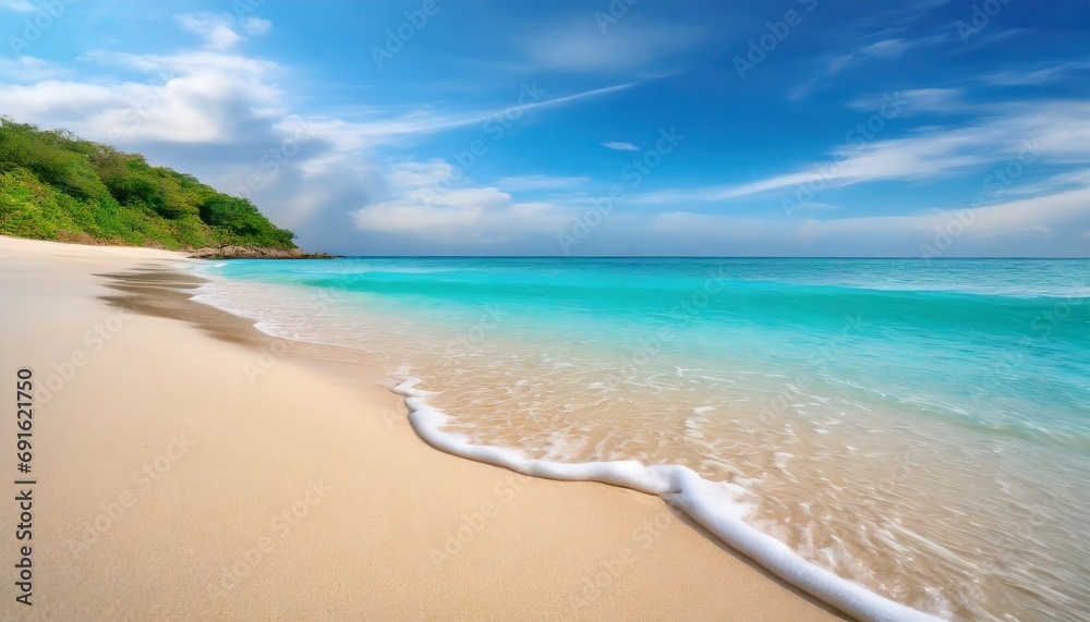 Beautiful sandy beach with white sand and rolling calm wave of turquoise ocean on Sunny day Beautiful sandy beach with white sand and rolling calm wave of turquoise ocean on Sunny day
