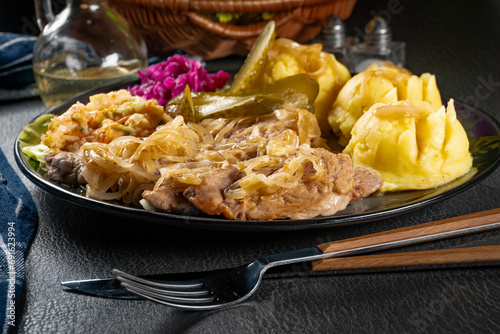 Pork tenderloin stewed in onions.