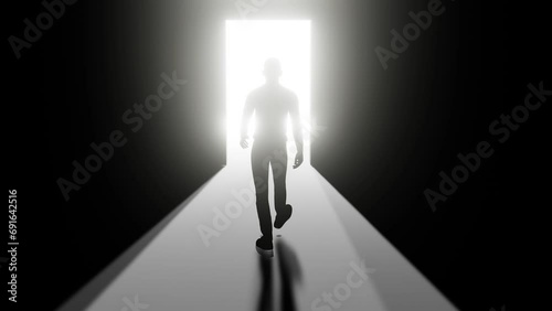 Man walks through a door into the light back view photo