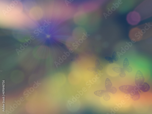 Kolorowe rozmyte tło z delikatnym motywem lecących w stronę światła motyli, bokeh