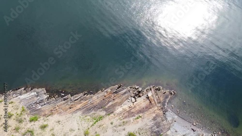 Oslo Island Rambergøya Abstract Rocky Shale Beach with Two People - Oslo, Norway 2.7K Aerial Footage photo