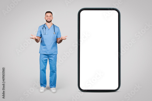 Happy male nurse presenting telemedicine concept on phone