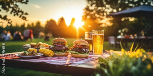 A backyard barbecue with sizzling burgers, grilled corn on the cob, and a variety of condiments - Casual and flavorful - Sunset lighting for a summery BBQ vibe - Candid shot,  photo