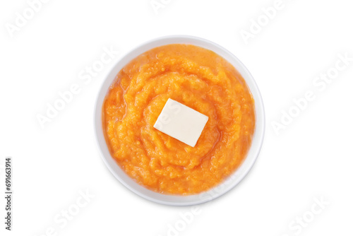 Cooked sweet potato puree in a bowl on a white isolated background photo