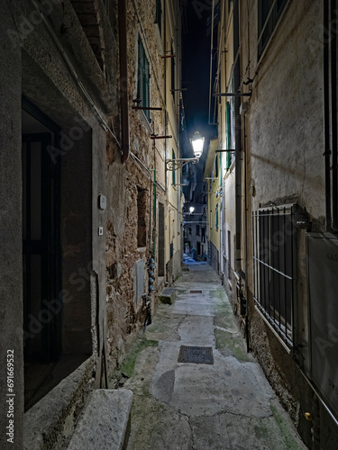 Narrow Italian old town alley at night