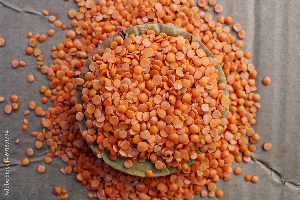Masoor Dal on a Leaf Plate with Grey Background Masoor Dal on a Leaf Plate with Grey Background