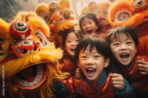 Cheerful group of Asian children celebrating Chinese New Year. Happy kid friends having fun during New Year celebration in Asian town.