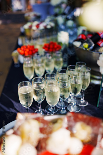 Champagne glasses on the buffet table. Table setting for a buffet at a party. 