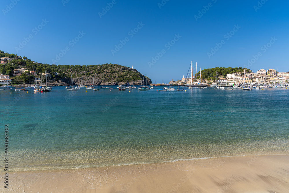 Beautiful view of the Port de Soller coastline. Harbor with many yachts and ships. Mallorca island, Spain, Mediterranean Sea. Balearic Islands