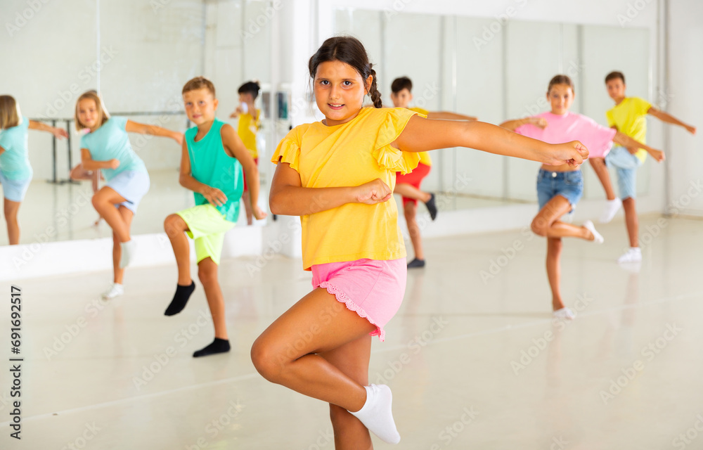 Fototapeta premium Active children dancing modern dances in a choreographic studio