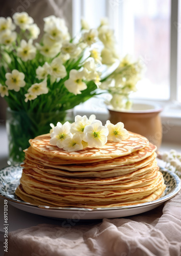a stack of fresh hot pancakes on a plate on the table, crepes, flowers, Maslenitsa, spring, breakfast, meal, bouquet, traditional Russian dish, flowering, baking, sunlight, still life, lunch, dinner