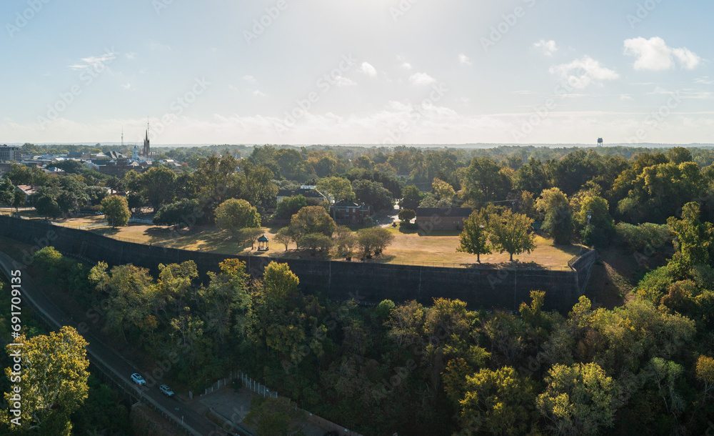 Grounds of mansion in cityscape of Natchez in Mississippi from aerial viewpoint