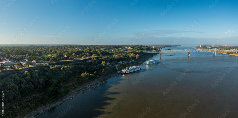 Modern Mississippi cruise boat and traditional riverboat docked by the bluff under the hill in Natchez Mississippi