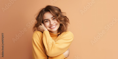 young pretty woman hugs herself, smiling carefree and happy on pastel background, generative AI