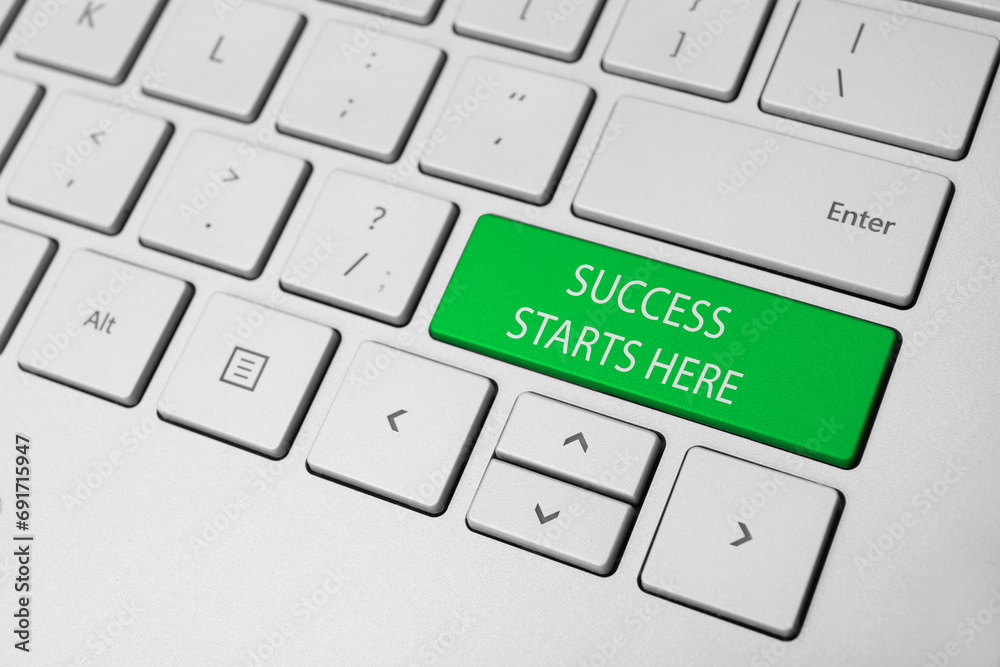 Button with text SUCCESS STARTS HERE on modern computer keyboard, closeup Button with text SUCCESS STARTS HERE on modern computer keyboard, closeup