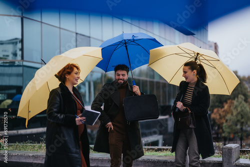 Young business people discussing project development in the city area on a rainy day. Collaborative teamwork for business expansion and profit growth.