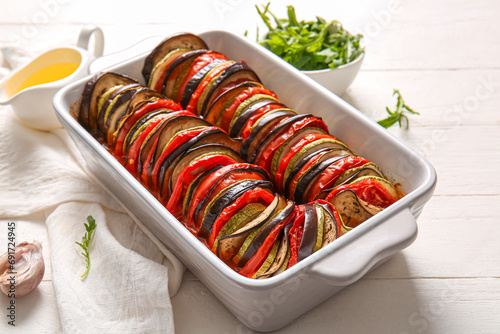 Baking dish of tasty Ratatouille on white wooden background