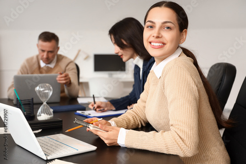 Young businesswoman working...