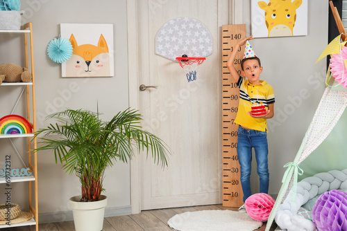 Cute shocked little boy wit...