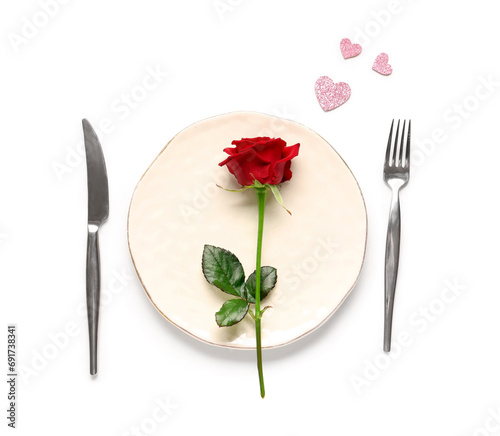 Beautiful table setting with red rose and hearts on white background. Valentine's Day celebration
