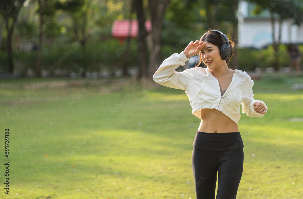 Portrait sport asian beauty body slim woman warming up in sportswear relax and do fitness exercise running and jogging in fitness training at park.Diet concept.Fitness and healthy Portrait sport asian beauty body slim woman warming up in sportswear relax and do fitness exercise running and jogging in fitness training at park.Diet concept.Fitness and healthy