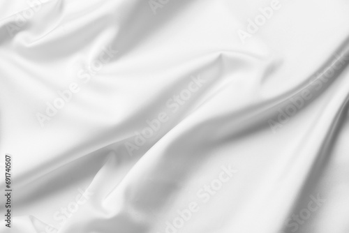 Texture of white silk ripple fabric as background, closeup