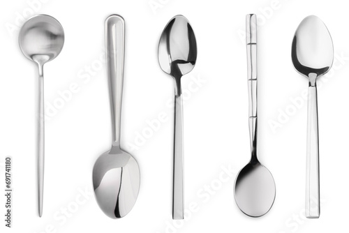 Different stylish silver spoons on white background photo