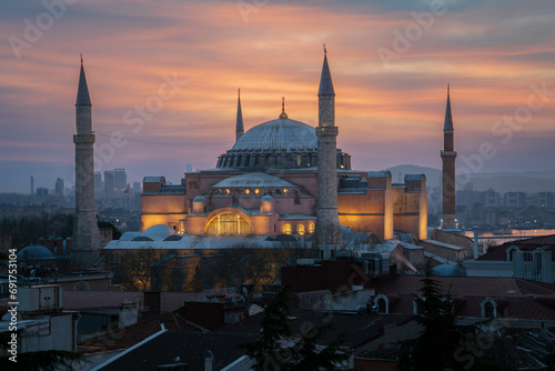 View of the Hagia Sophia Grand Mosque from the roof of the house against the background of the dawn sky on a foggy morning, Istanbul, Turkey