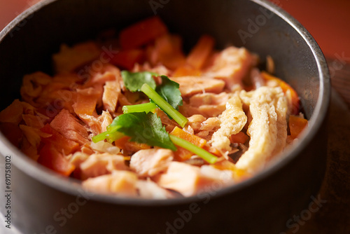 Stone pot rice with fish and vegetables photo