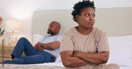 Frustrated black couple, conflict and divorce on bed in argument, disagreement or fight at home. African woman ignore man in bedroom dispute, cheating affair or breakup in toxic relationship at house photo