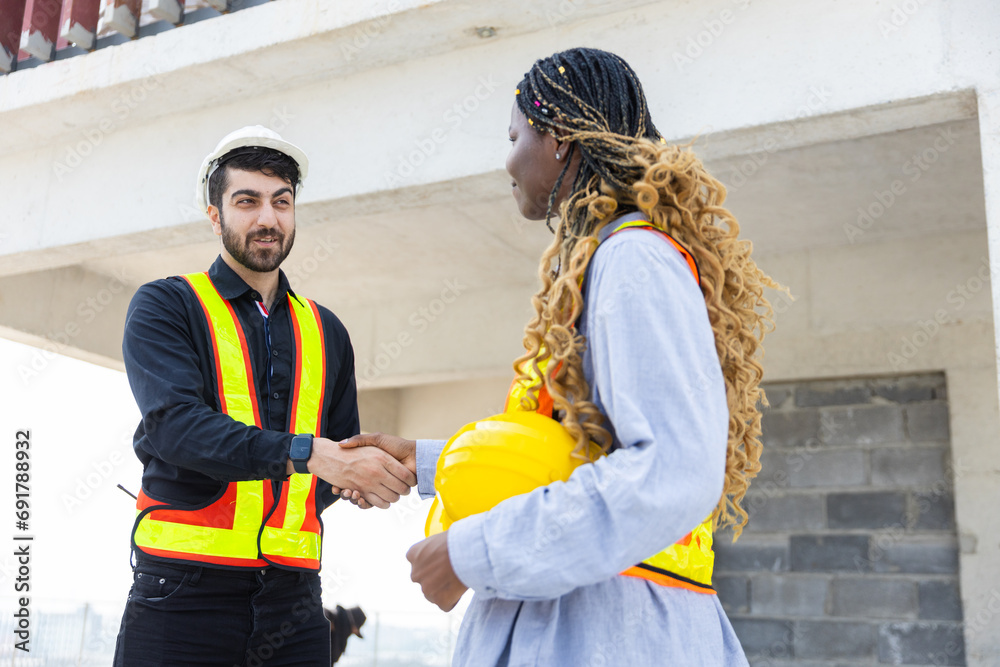 Engineering and foreman shaking hands on construction site and Agree. partnership and connection. Architect building supervising and inspector deal successful. - obrazy, fototapety, plakaty 