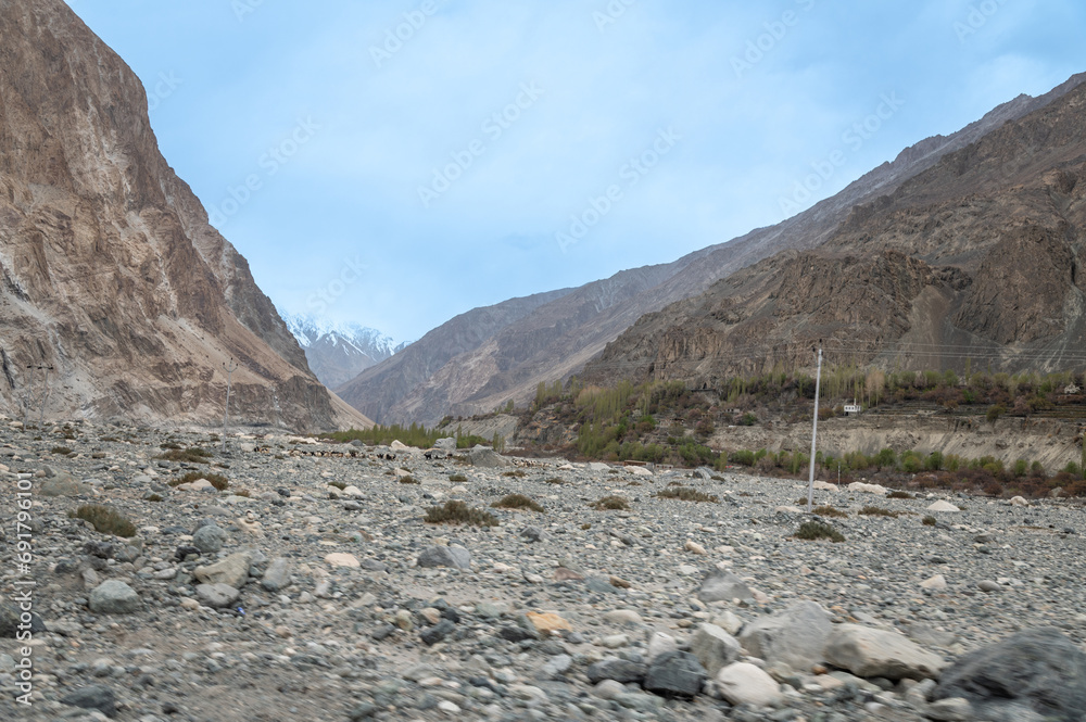 Scenic view of Himalayas and Ladakh ranges. Beautiful barren hills in Ladakh with dramatic clouds in the background.  View from the road from Nubra Valley to Turuk. 